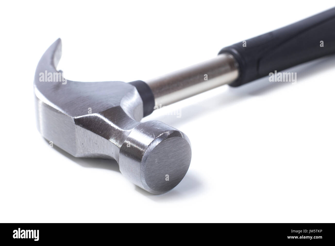 Head of a shiny new steel claw hammer in a close up view over a white background lying diagonally in the frame with copy space Stock Photo