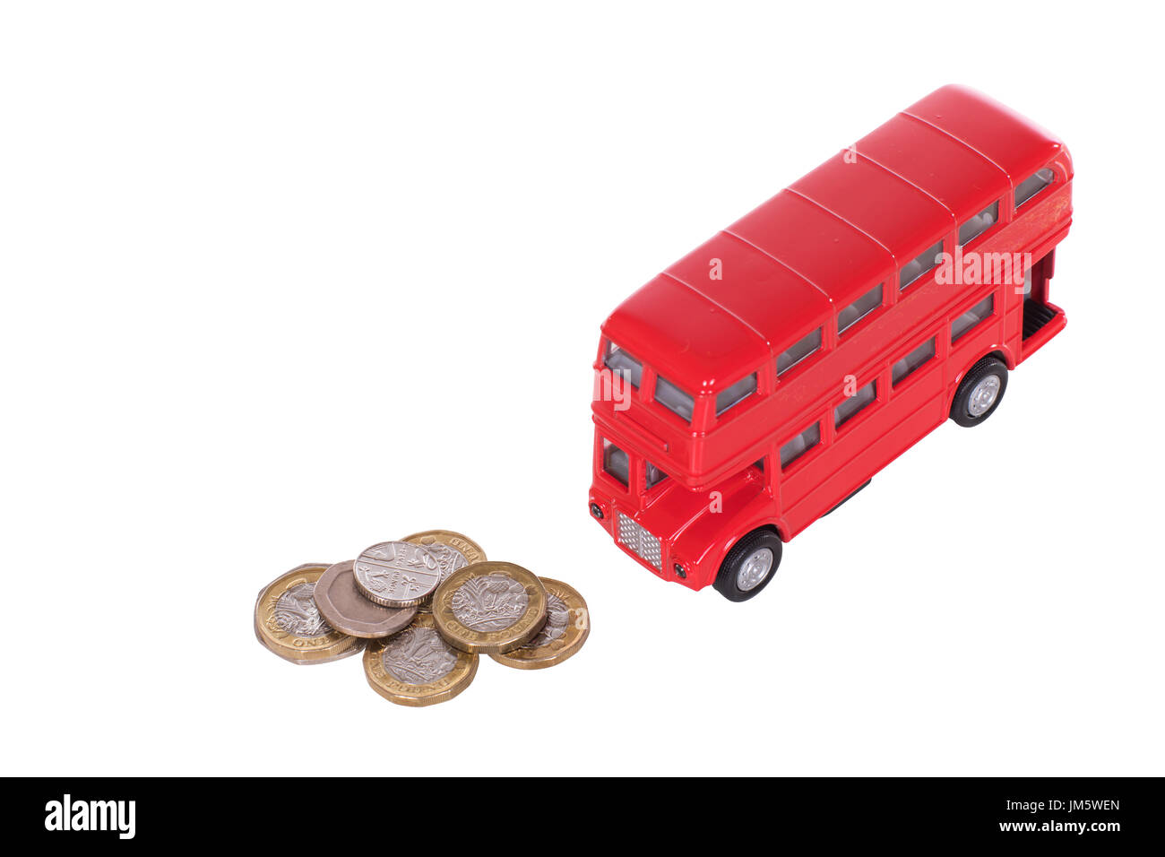 Red double-decker bus with a pile of loose sterling change in a concept of the costs of public transport in Britain isolated on white Stock Photo
