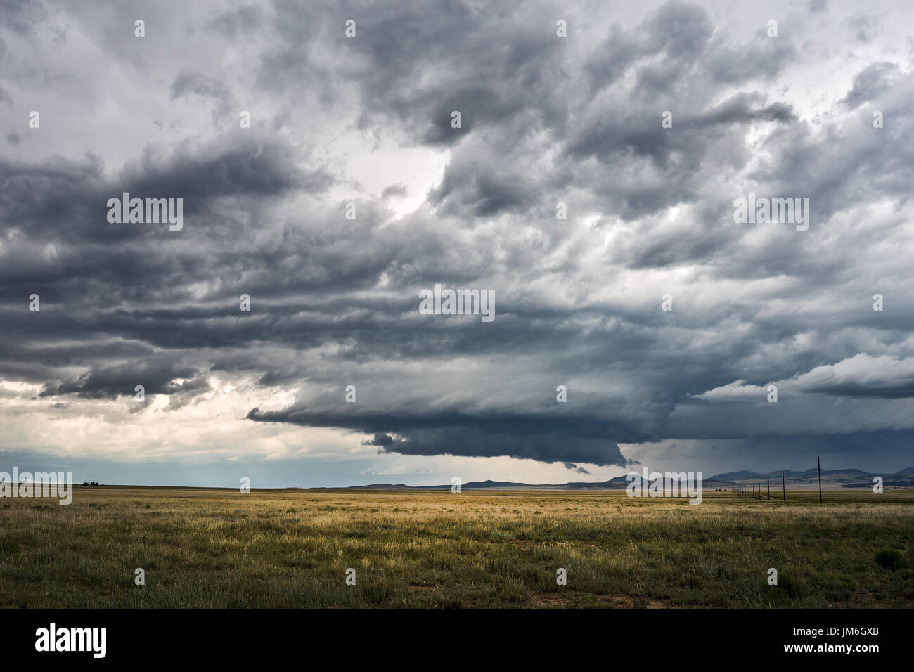 Mesocyclone and rotating wall cloud on a supercell thunderstorm in New Mexico Stock Photo
