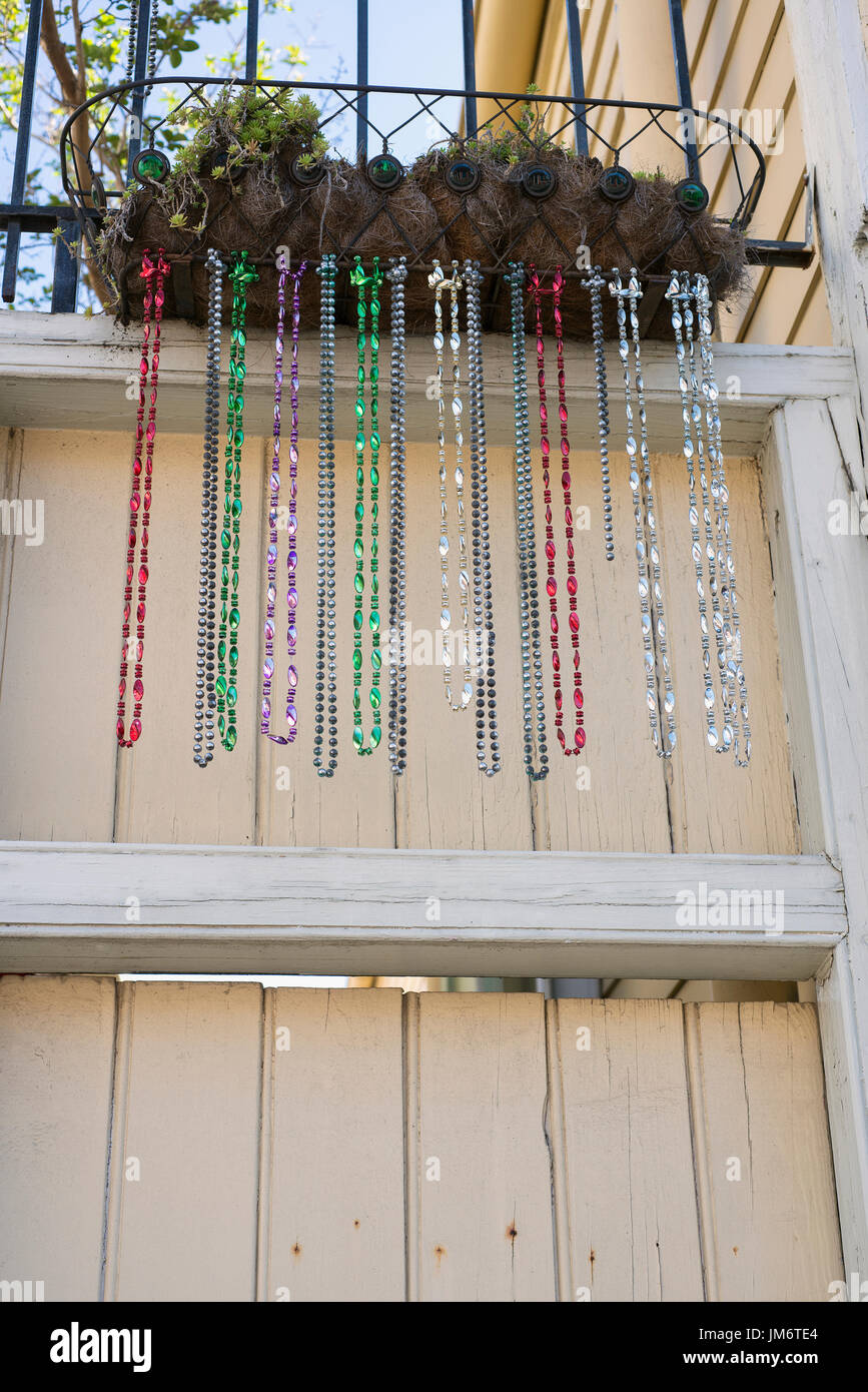 Mardi Gras beads being used as planter decorations in New Orleans, Louisiana. Stock Photo