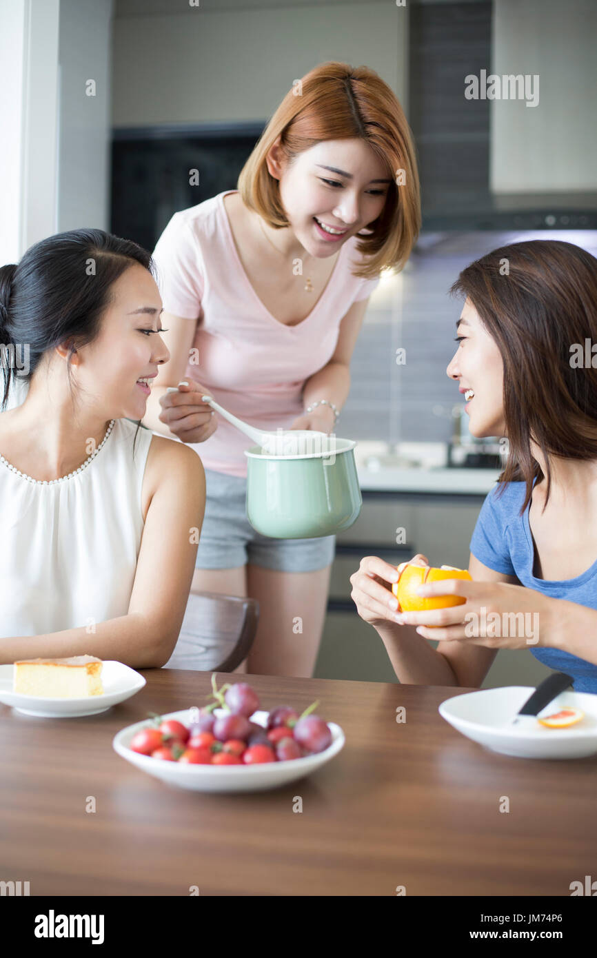 Best female friends cooking at home Stock Photo