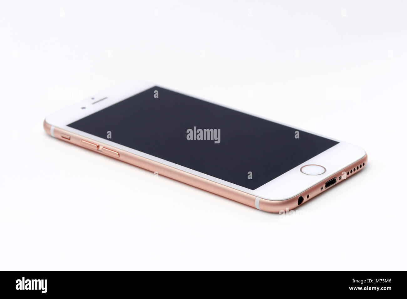 Rose gold, pink white Apple iPhone 6s with blank black screen lying isolated on white background Stock Photo