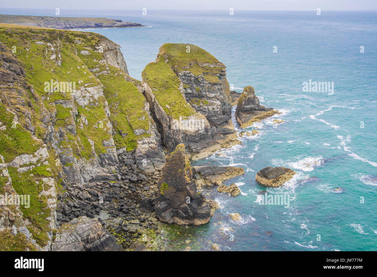 A peaceful and calming coastal landscape view of the ocean and cliff edge of Holyhead, UK. Stock Photo