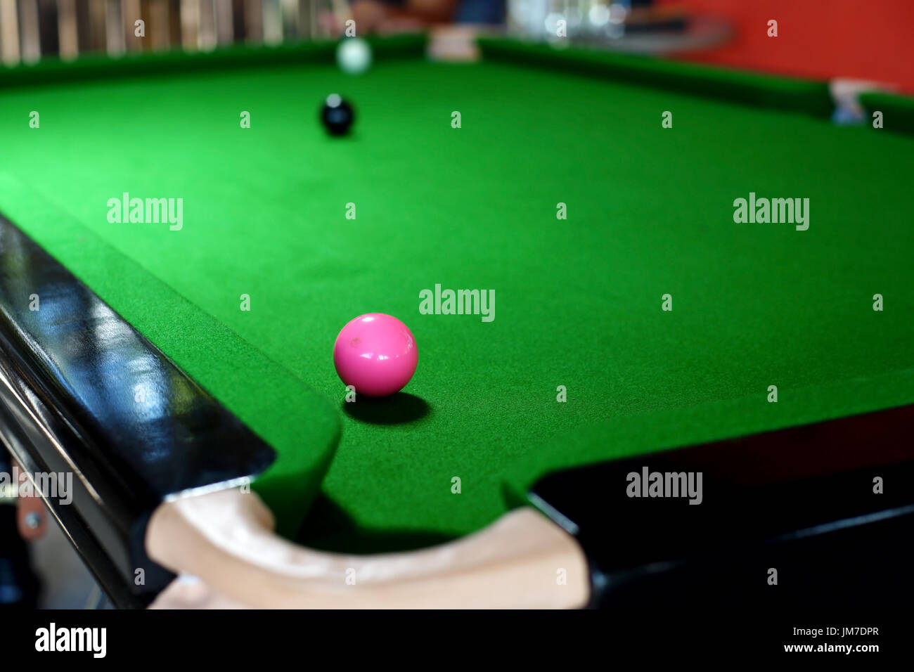 pink ball on snooker table near to a pocket Stock Photo - Alamy
