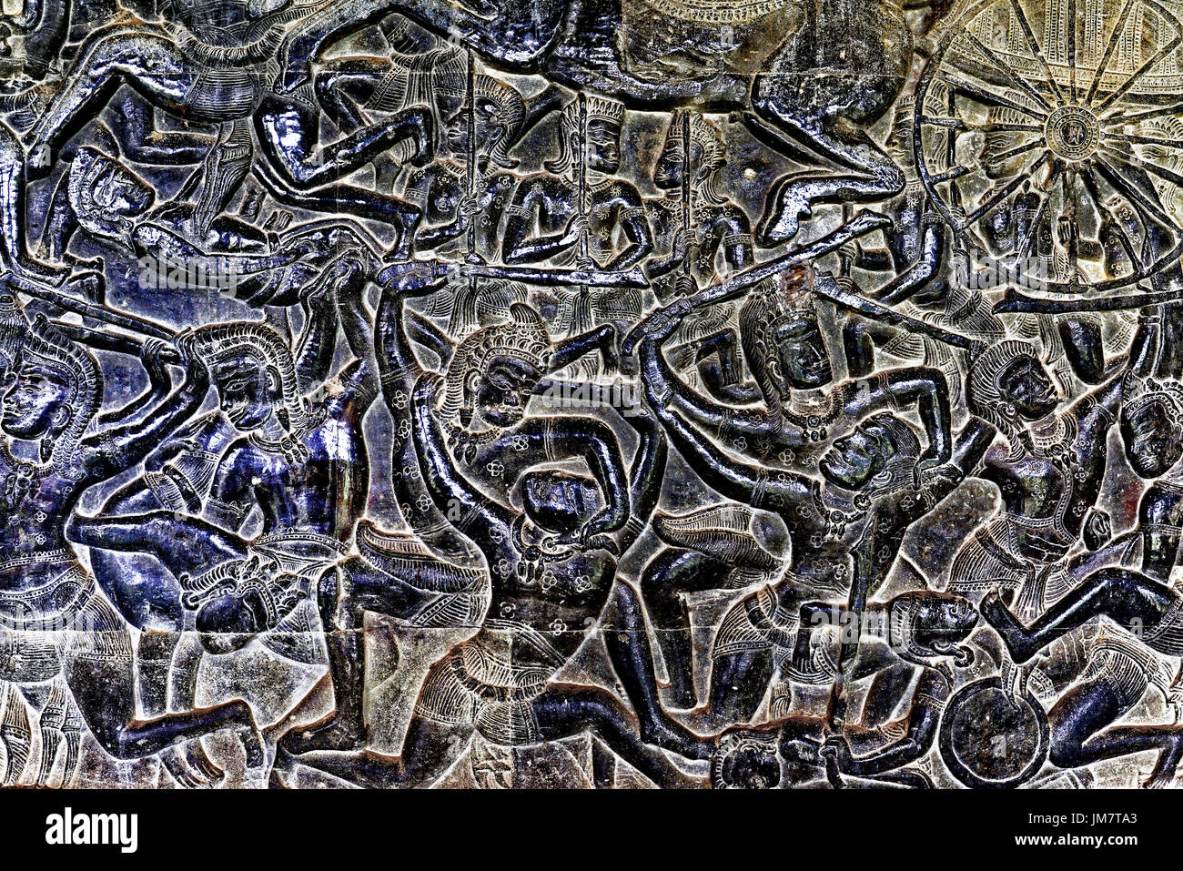 Cambodia Angkor Wat internal temple complex wall carving Khmer warriors chariots and horses in battle Stock Photo