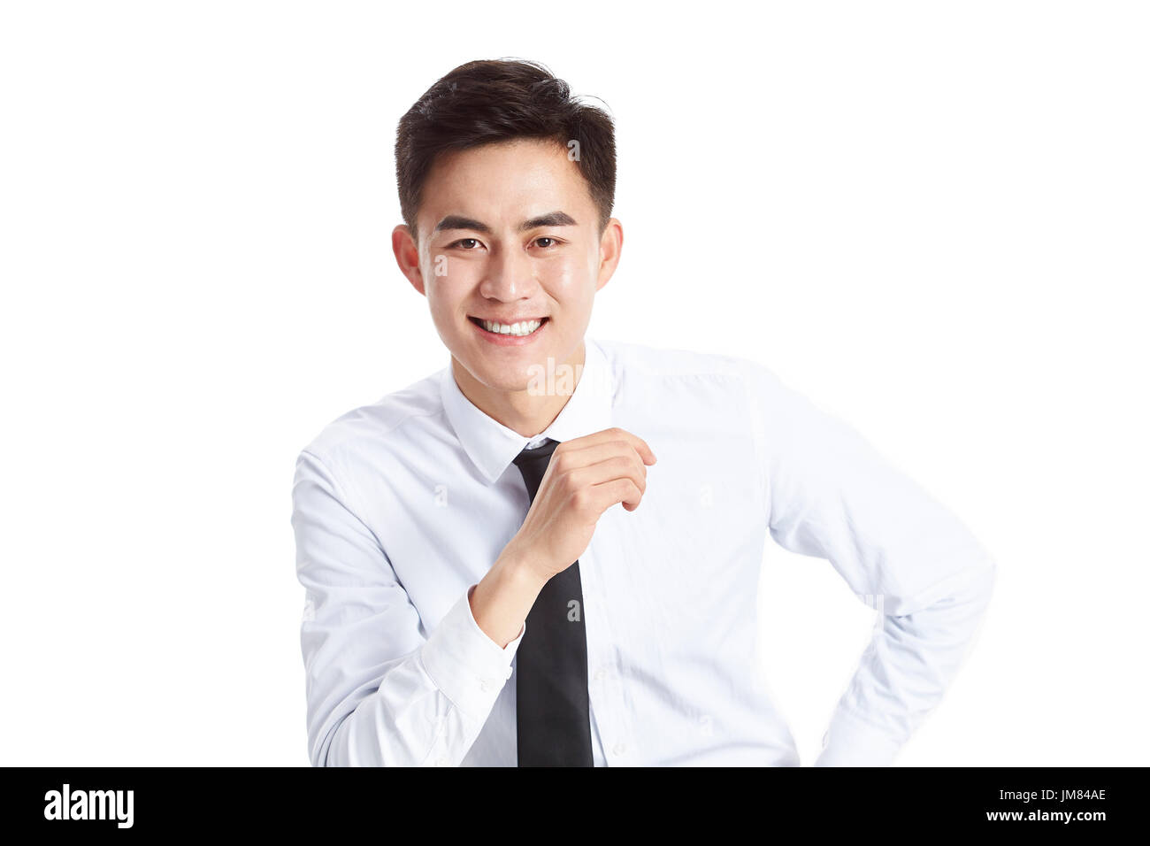 studio portrait of a young asian businessman wearing shirt and tie ...