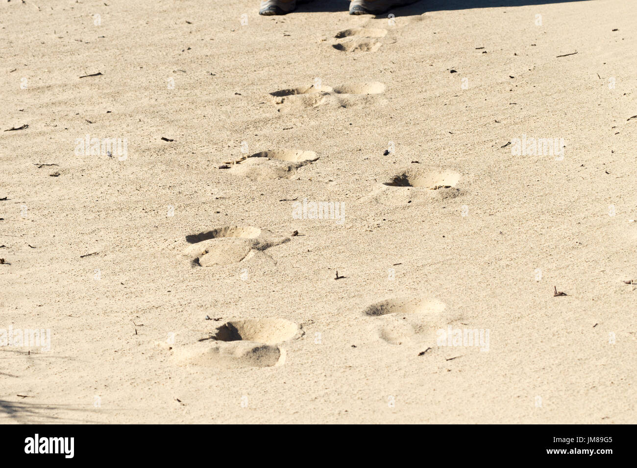 Footprints on yellow sand horizontal image Stock Photo