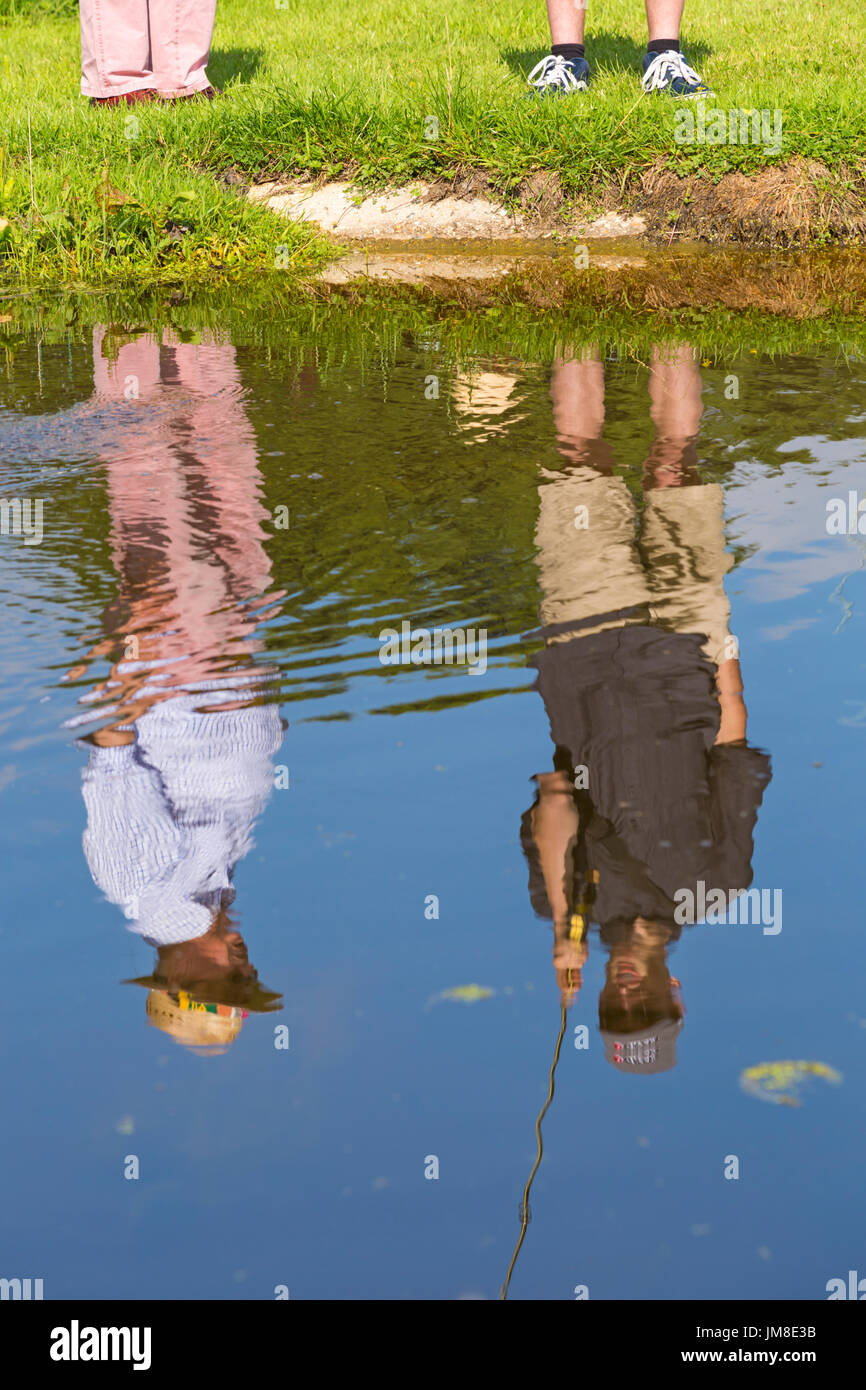 Practicing fly fishing at the New Forest & Hampshire Country Show, Brockenhurst, Hampshire - reflections Stock Photo