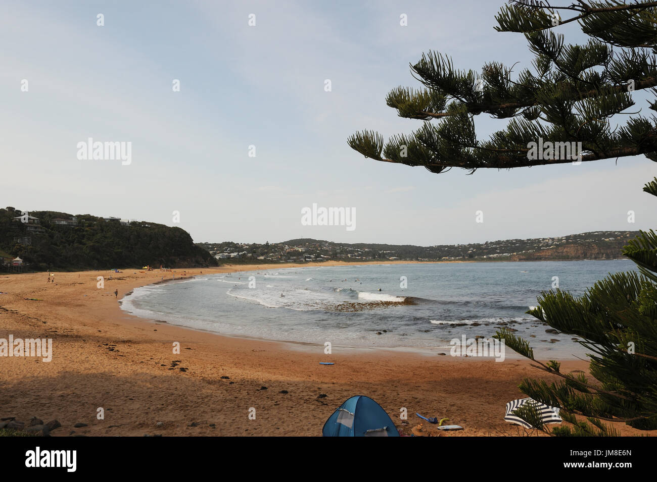 View of Macmasters Beach with people swimming, lazing about in tent. Macmasters Beach. New South Wales. AUSTRALIA Stock Photo