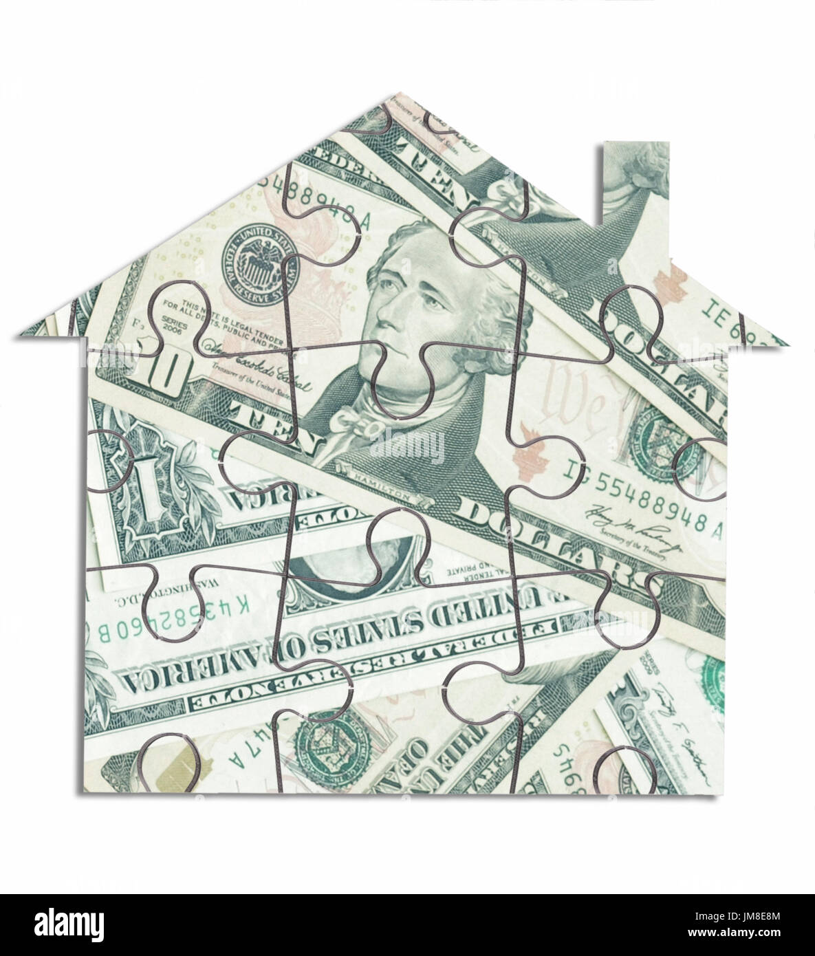 Dollar house jigsaw puzzle over a white background Stock Photo