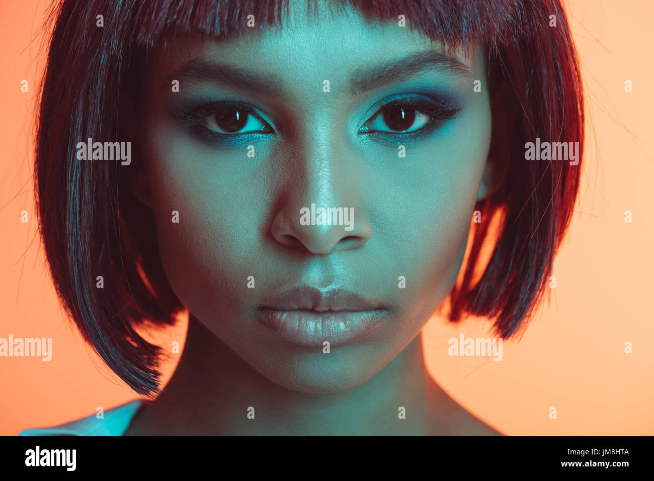 close up portrait of attractive african american girl looking at camera ...