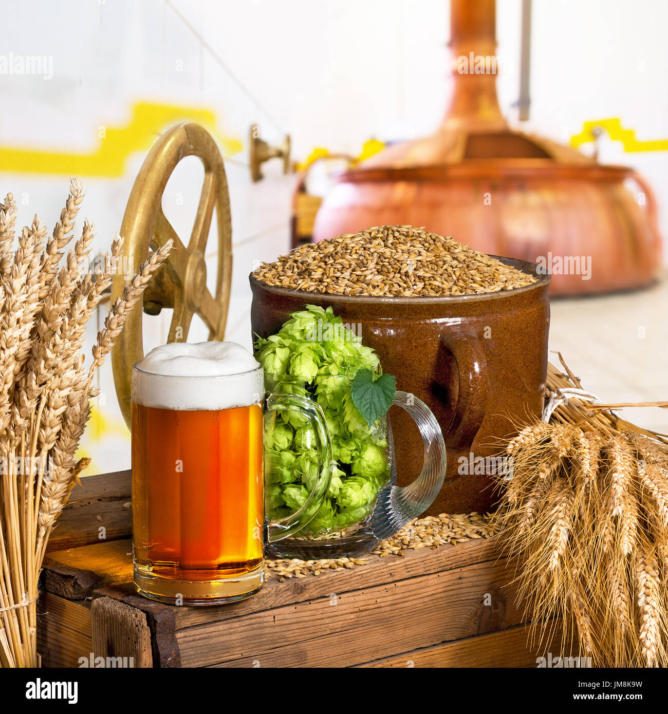 Beer Glass and Raw Material for BeerProduction in the Brewery Stock Photo