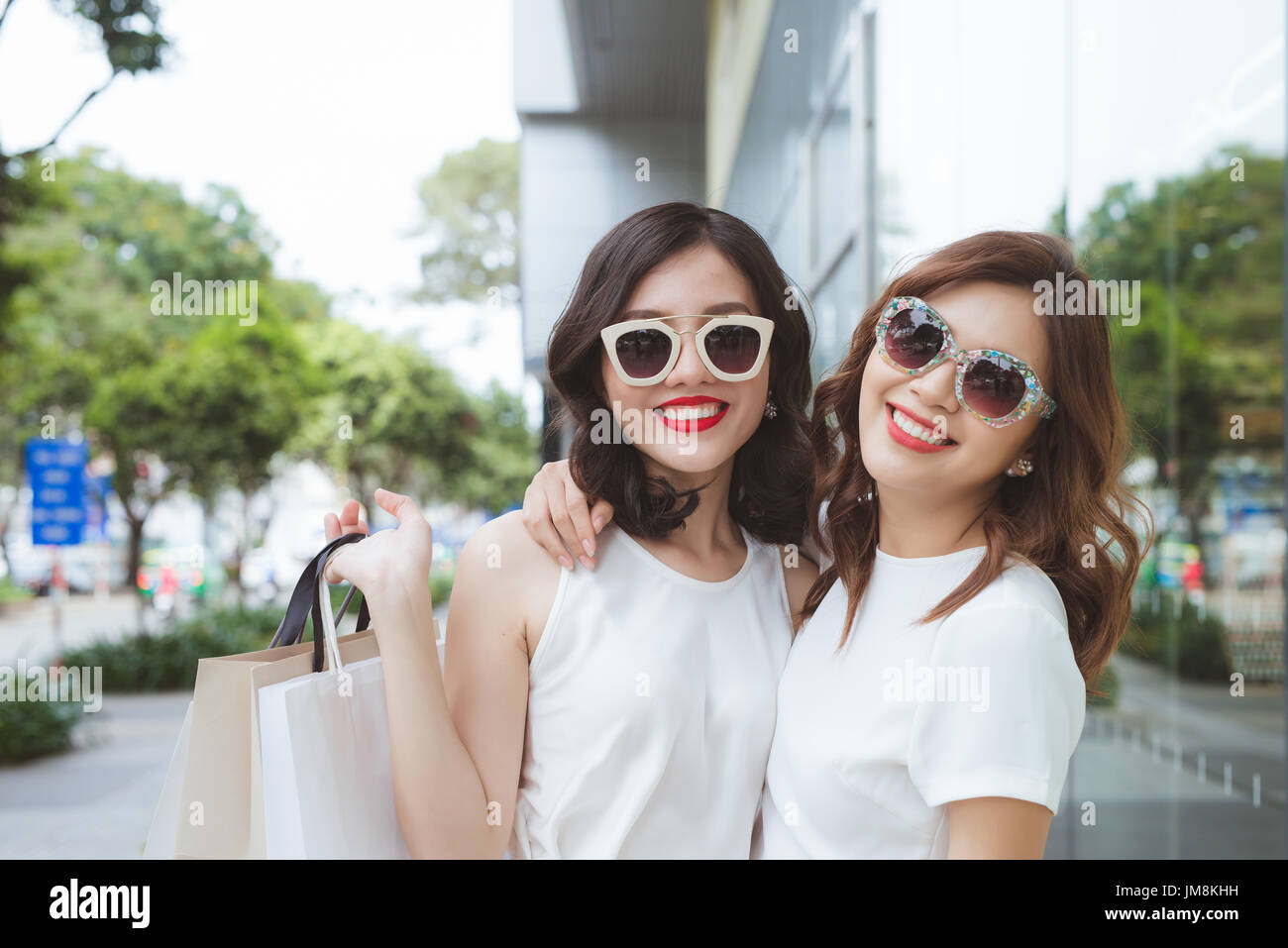 Two beautiful girls window shopping in the city Stock Photo