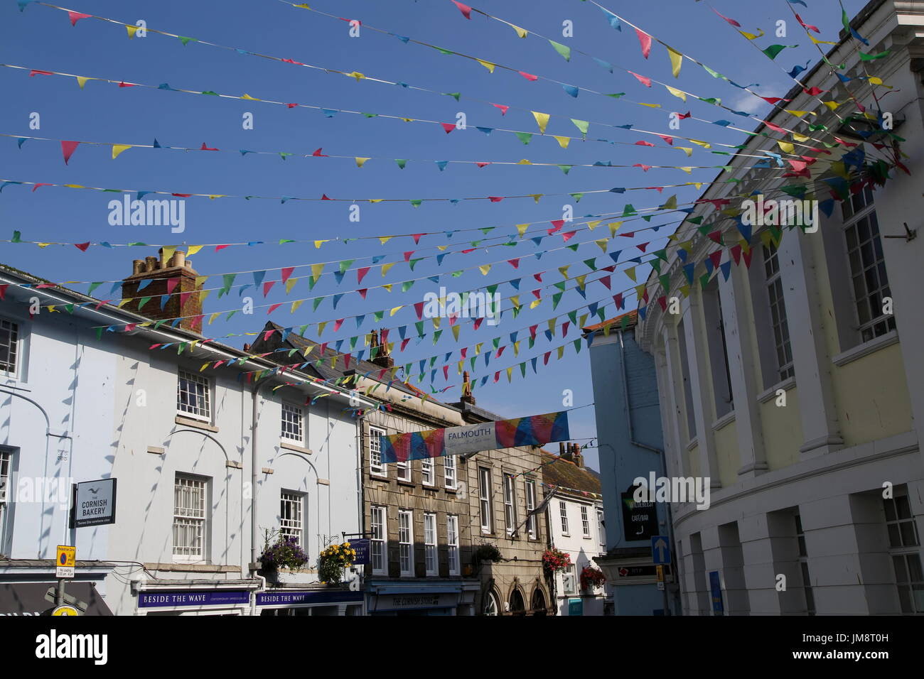 Bunting flags flying in street of town centre, Falmouth, Cornwall, England, UK Stock Photo