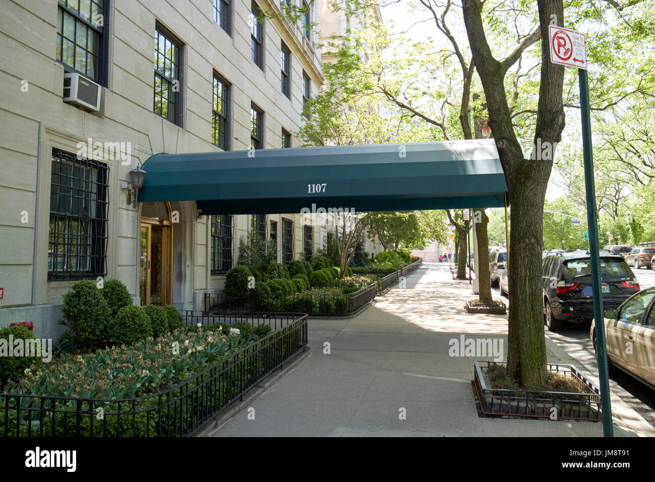 sidewalk canopy outside expensive luxury apartment building 1107 5th avenue upper east side New York City USA Stock Photo