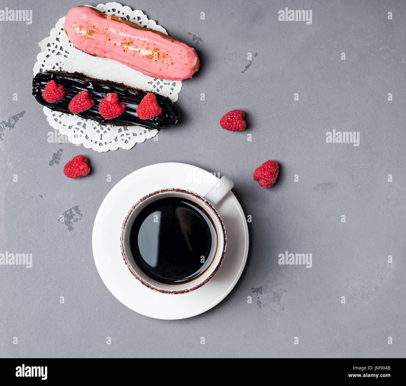 Delicious eclairs and coffee, top view Stock Photo