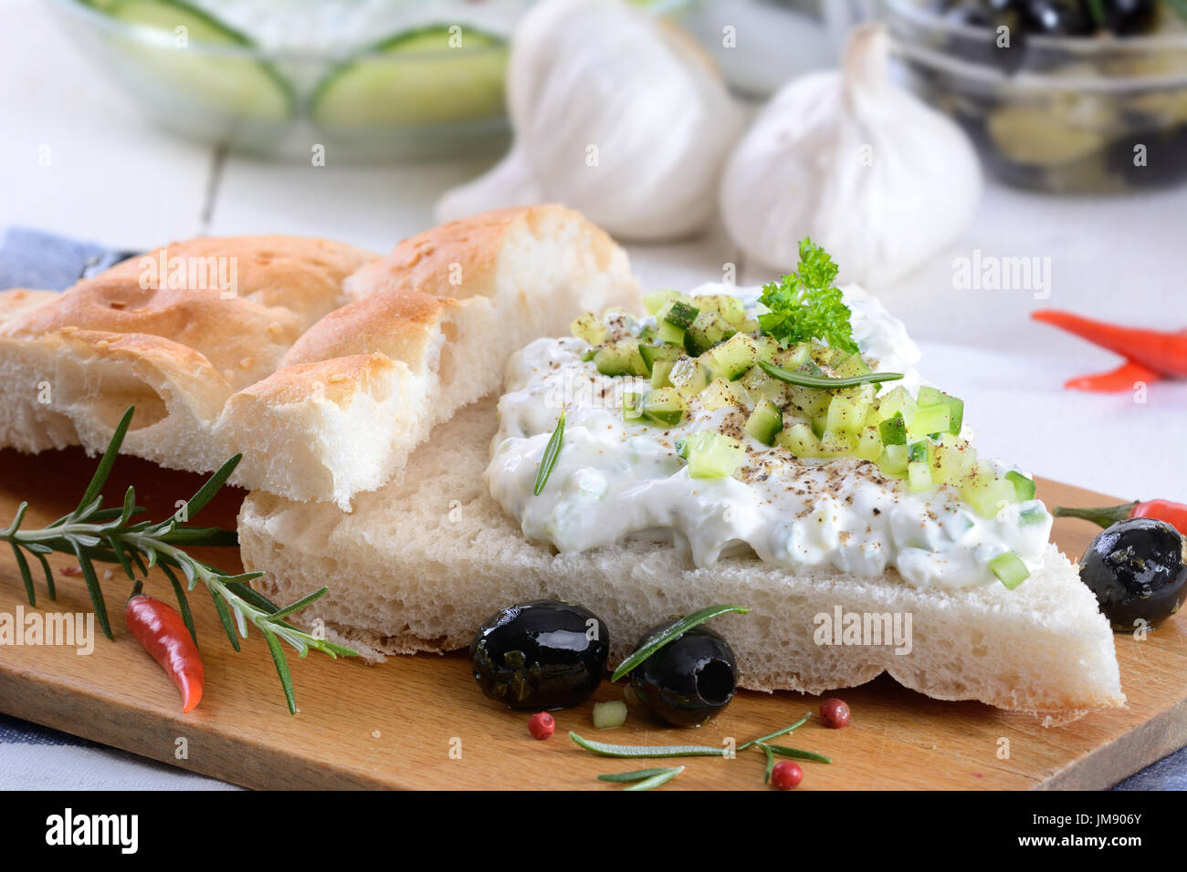 Fresh Greek tzatziki with garlic and cucumber on pita bread Stock Photo