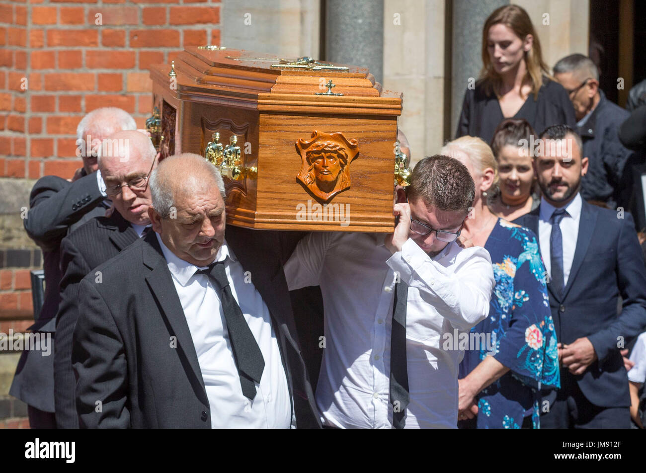 The coffin of Billy McConville, son of IRA murder victim Jean McConville, is taken from St Paul's Parish Church, Belfast following his funeral service. Stock Photo