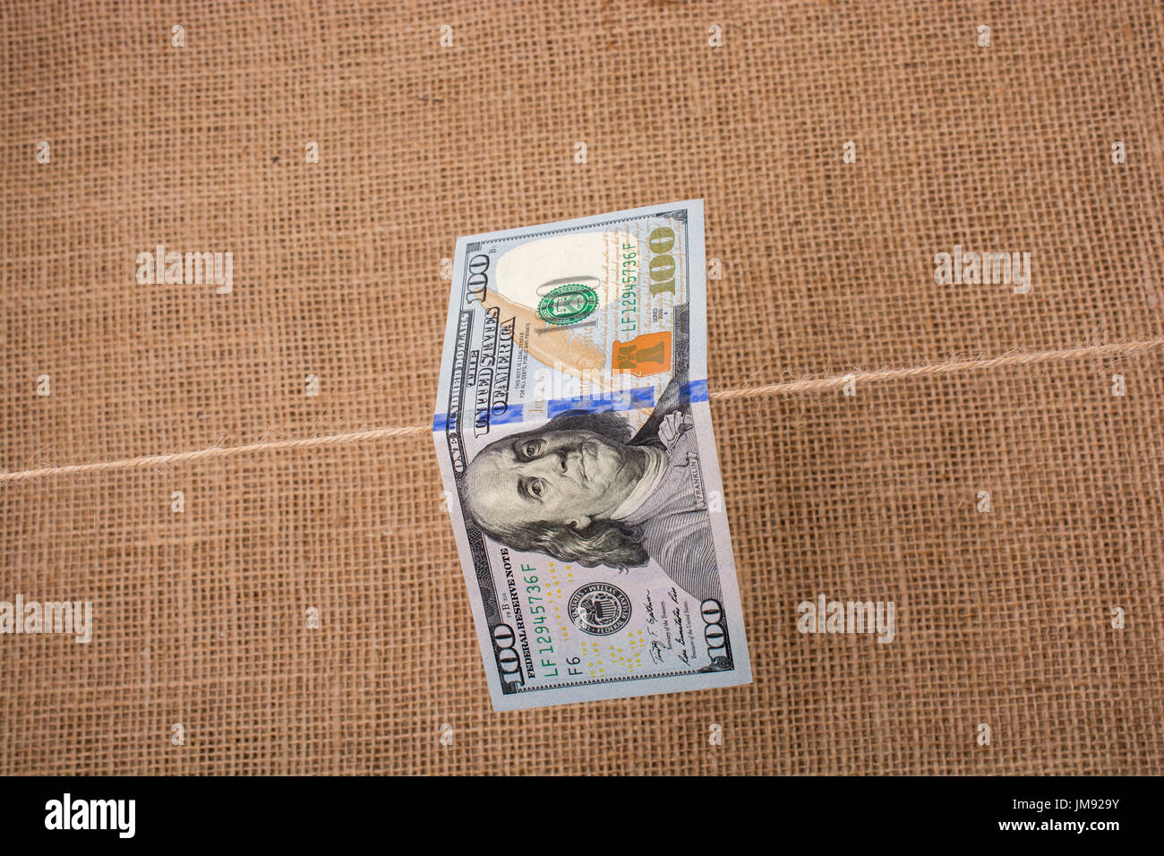 Banknote of US dollar hanging on a linen string Stock Photo - Alamy