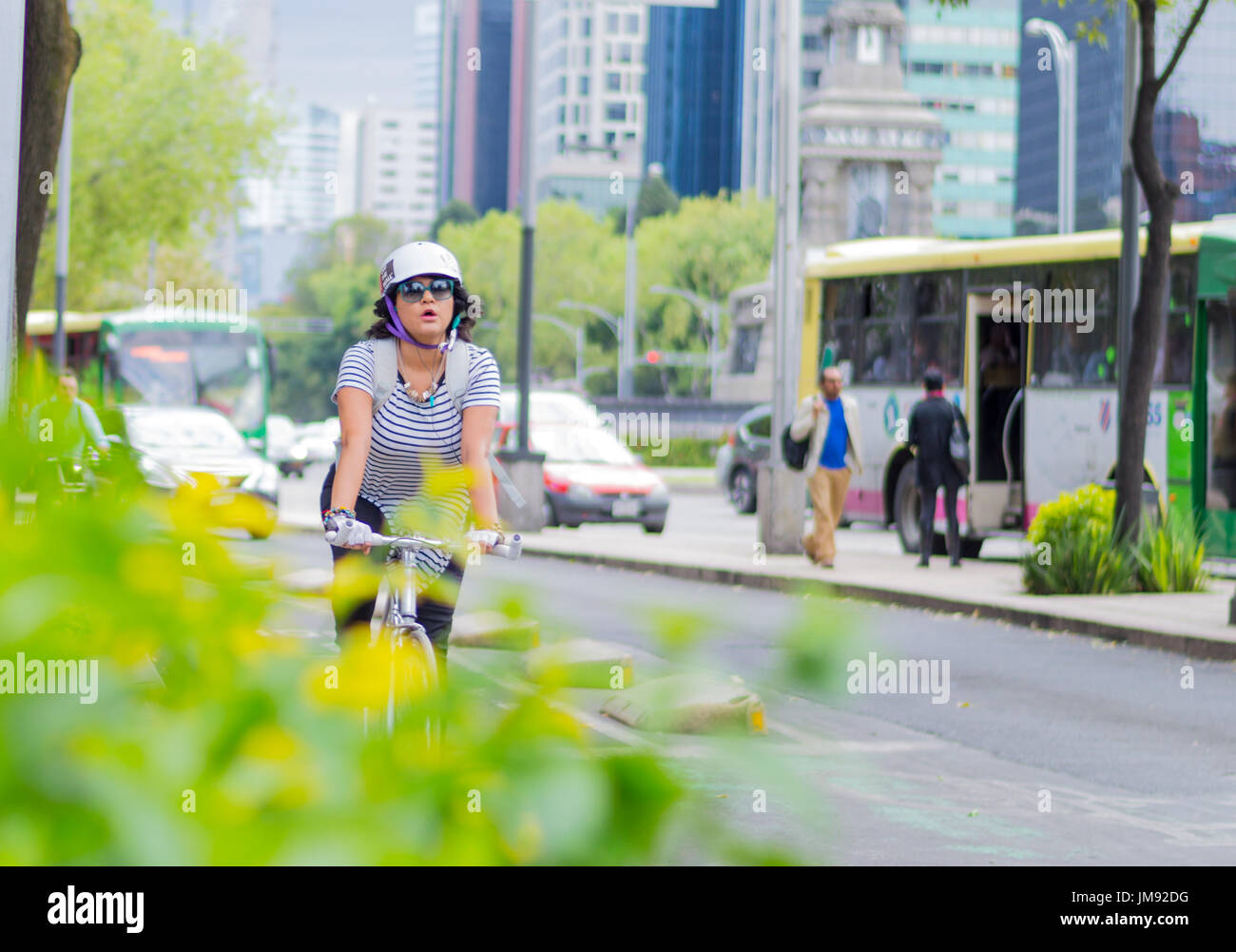 Young woman biker at paseo Reforma, Mexico DF Stock Photo