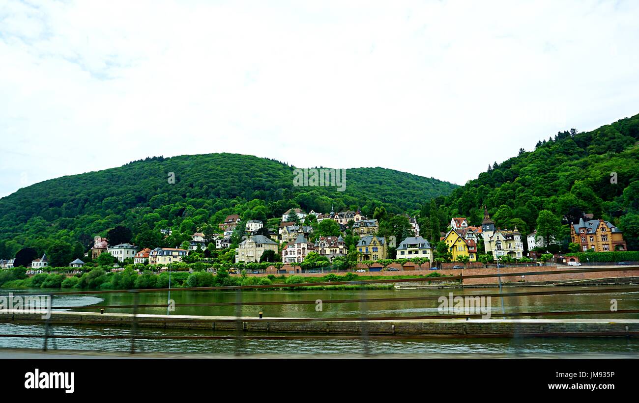Housings and buildings community up hill on the other side of old town Heidelberg across Neckar river, Heidelberg, Germany Stock Photo