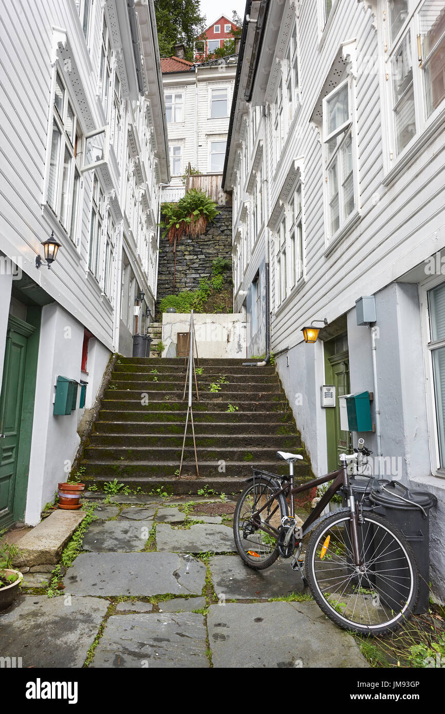 Traditional norwegian facades. Antique street in Bergen. Norway. Vertical Stock Photo