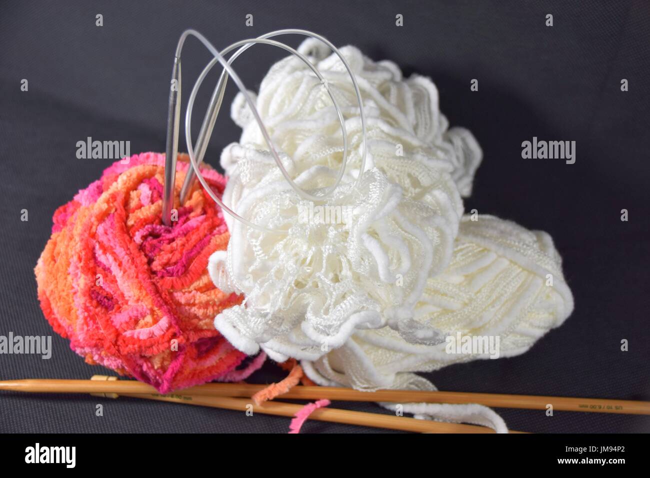 balls of wool for knitting and crocheting work done by hand Stock Photo