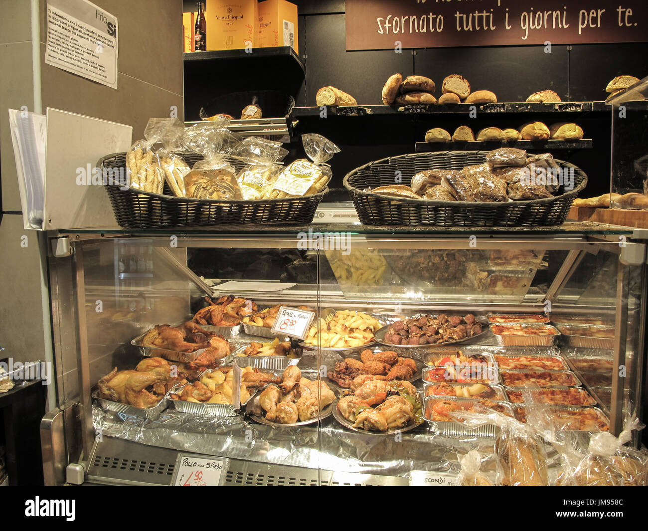 A display of  bread counter with large fresh bakery products into a supermarket in Italy. Rome Stock Photo