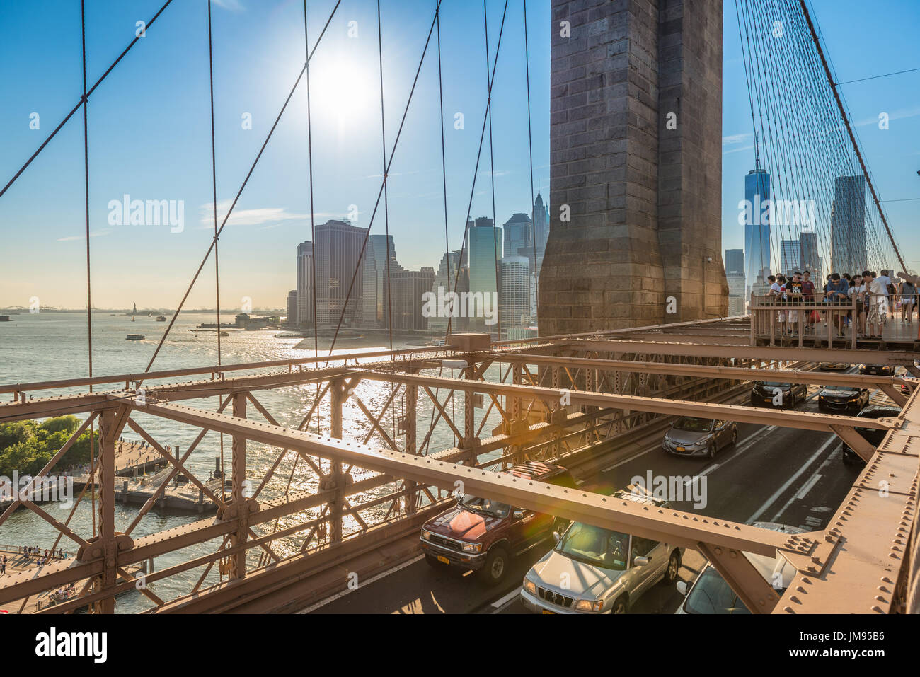 Views of Lower Manhattan and New York from the Brooklyn Bridge during summertime, New York, USA Stock Photo