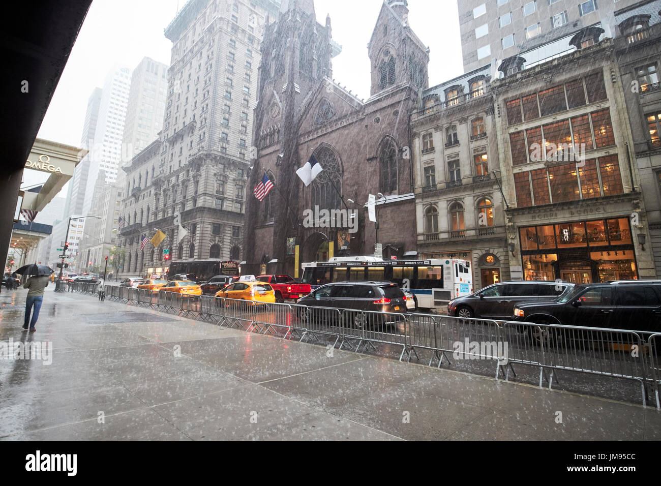 empty sidewalk in heavy rain fifth avenue New York City USA Stock Photo