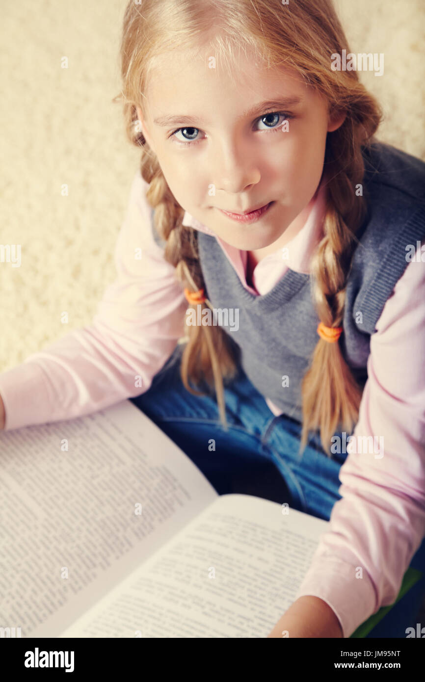 schoolgirl with a book Stock Photo - Alamy