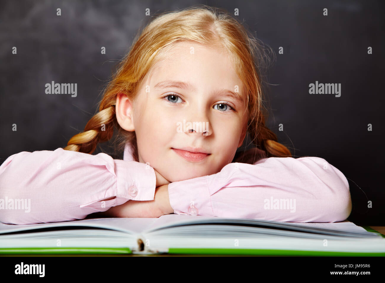 schoolgirl with a book Stock Photo - Alamy