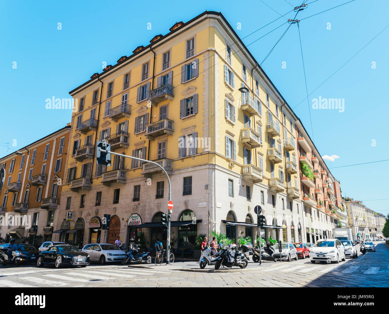 Milan, Italy - July 25th, 2017: A busy street corner in Milan, Italy during the summer Stock Photo