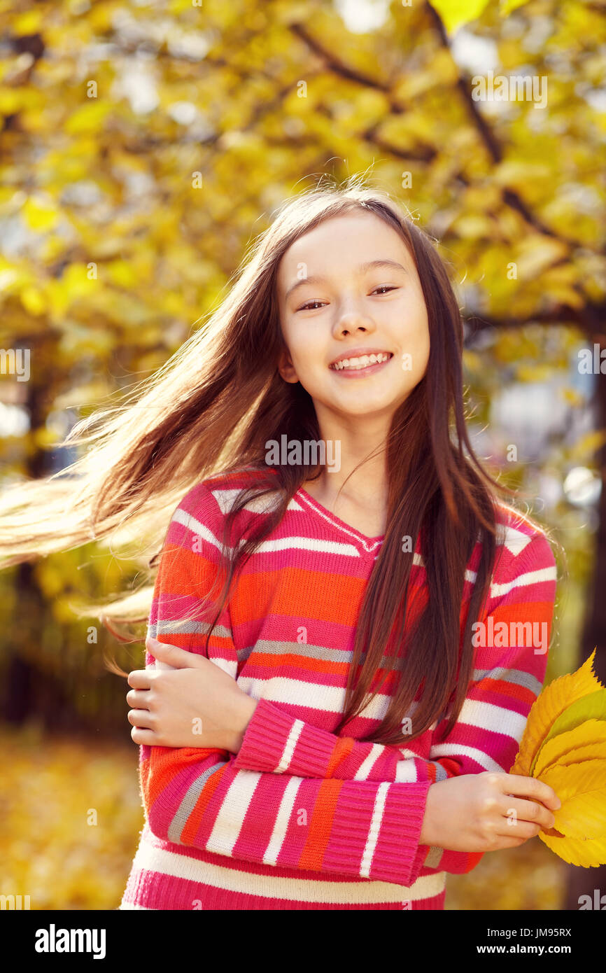 Girl with leaves Stock Photo - Alamy