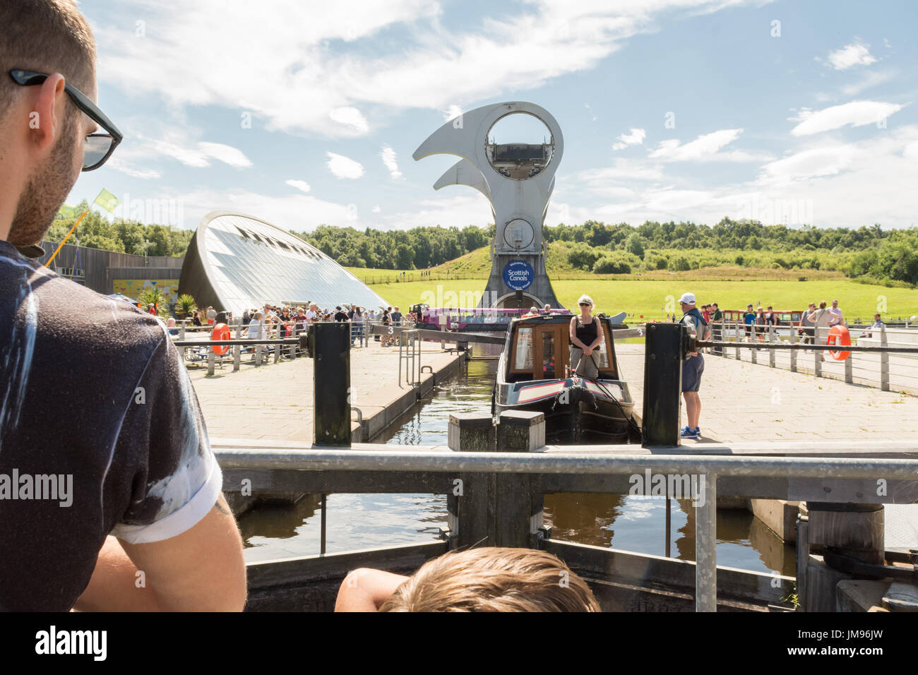 Falkirk Wheel - narrowboat passing through the lock at the bottom of the Falkirk Wheel, Scotland, UK Stock Photo