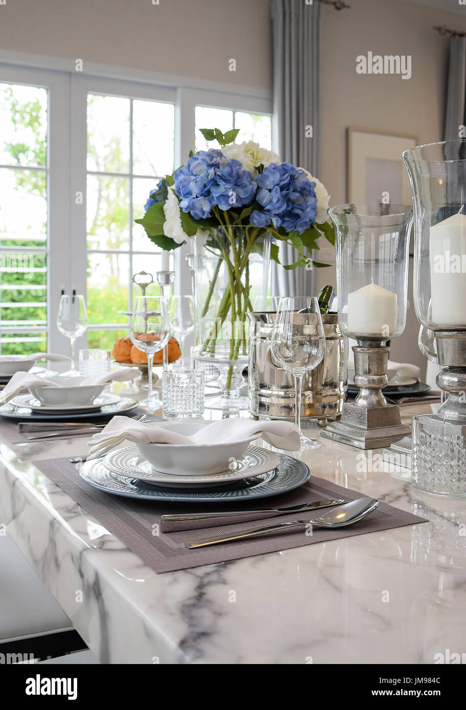 elegant table set in vintage style dining room interior Stock Photo - Alamy