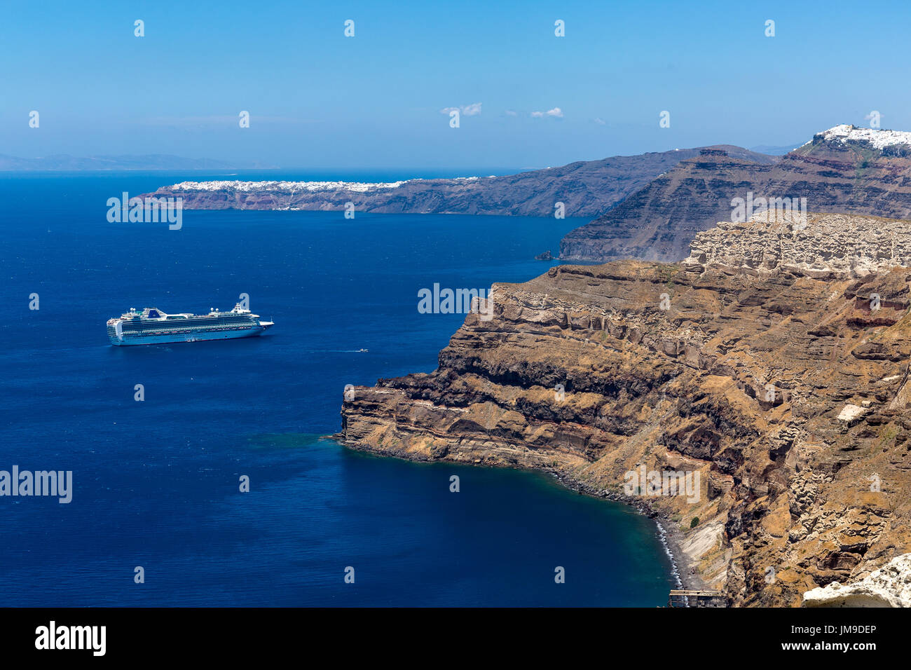 Cliffs and rock faces showing geological strata. Santorini Greece Stock Photo