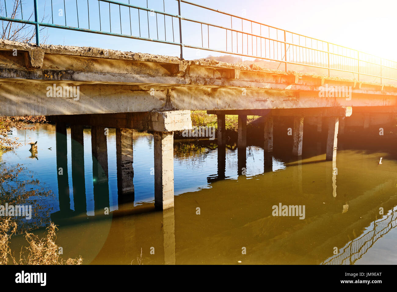 View of the neglected old bridge that consists of concrete slabs ...