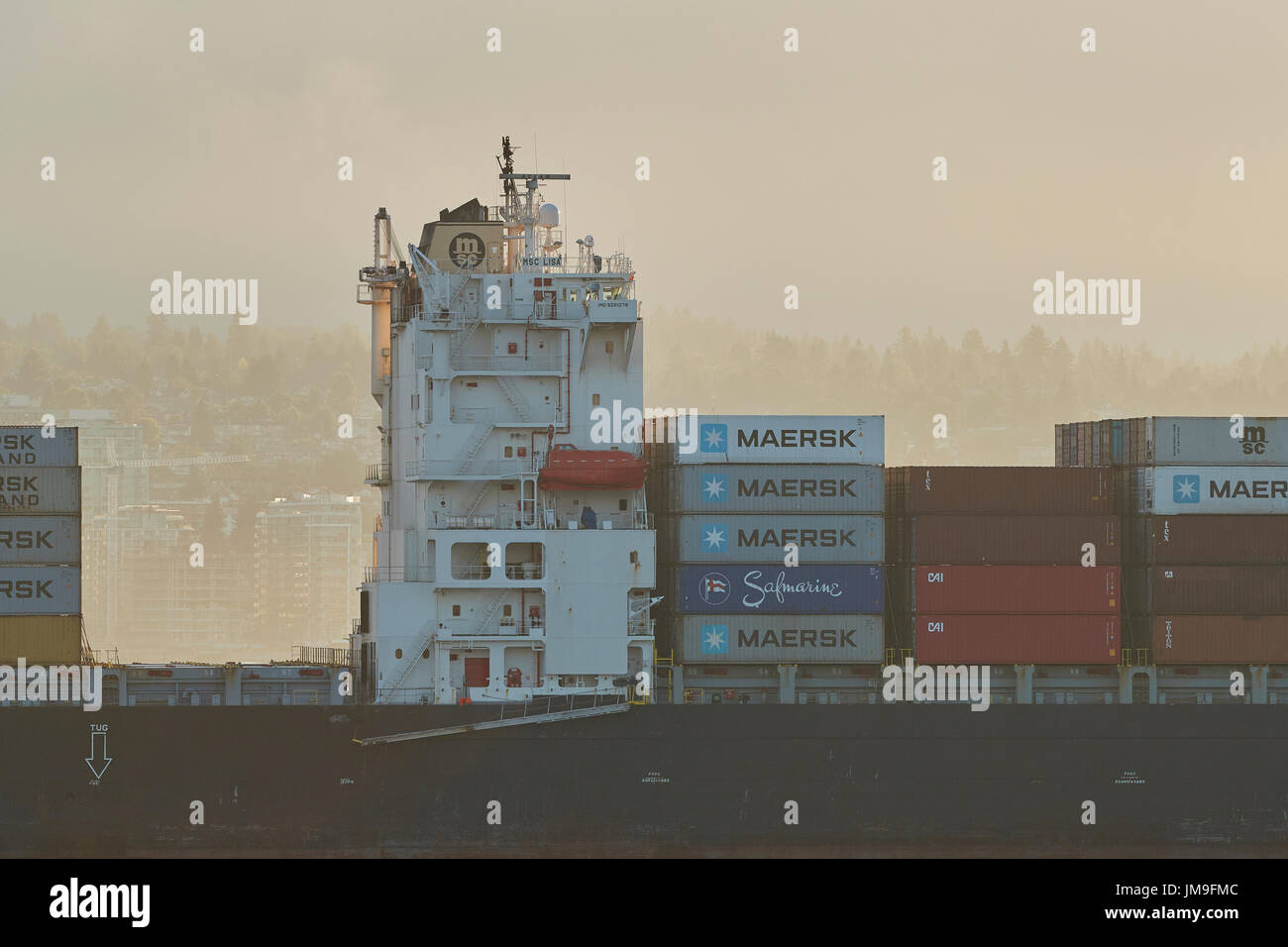 Container Ship MSC LISA, Arriving In Vancouver At Sunrise Stock Photo