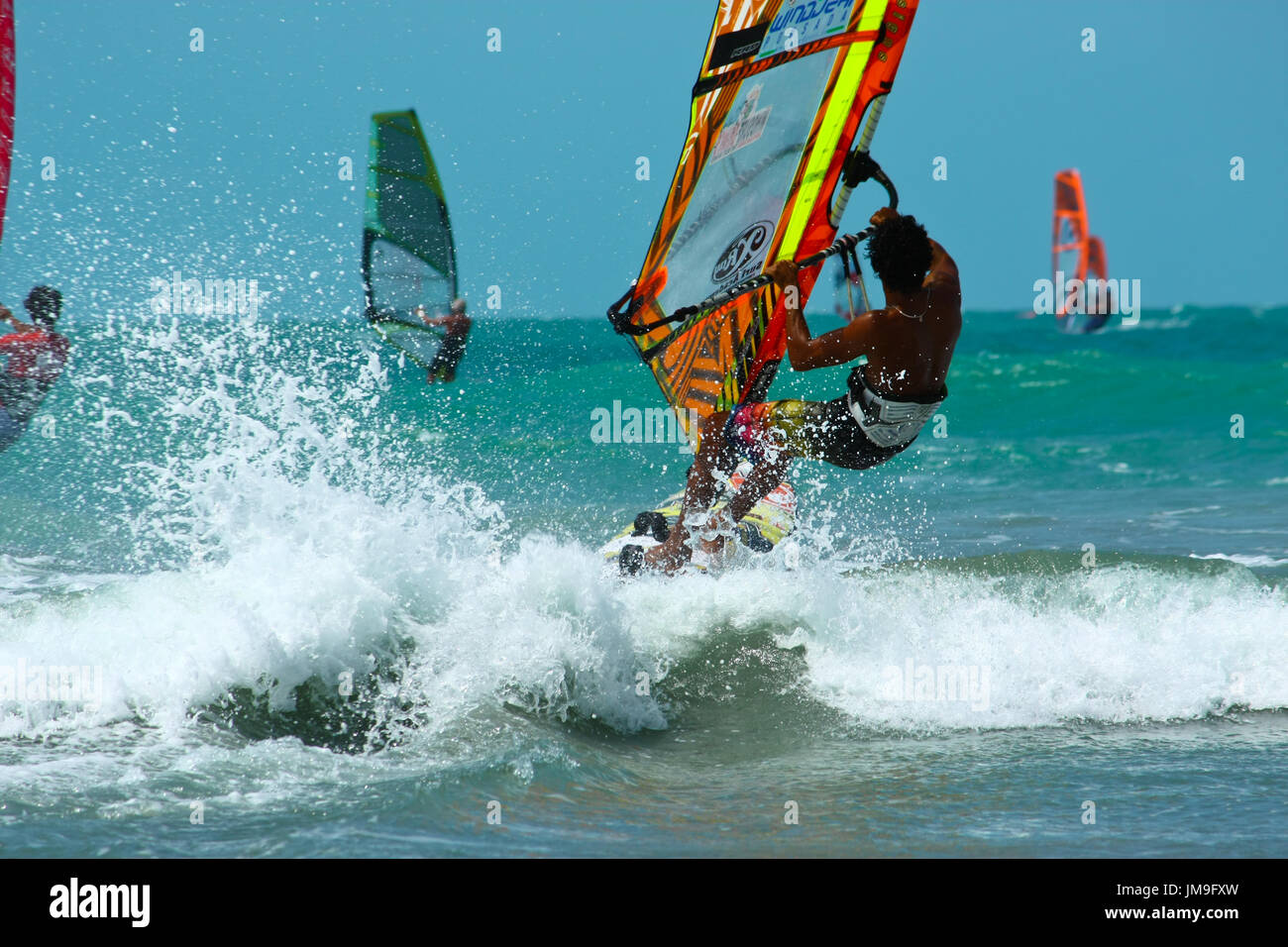 Windsurfing is riding on ocean waves leaving the drops Stock Photo Alamy
