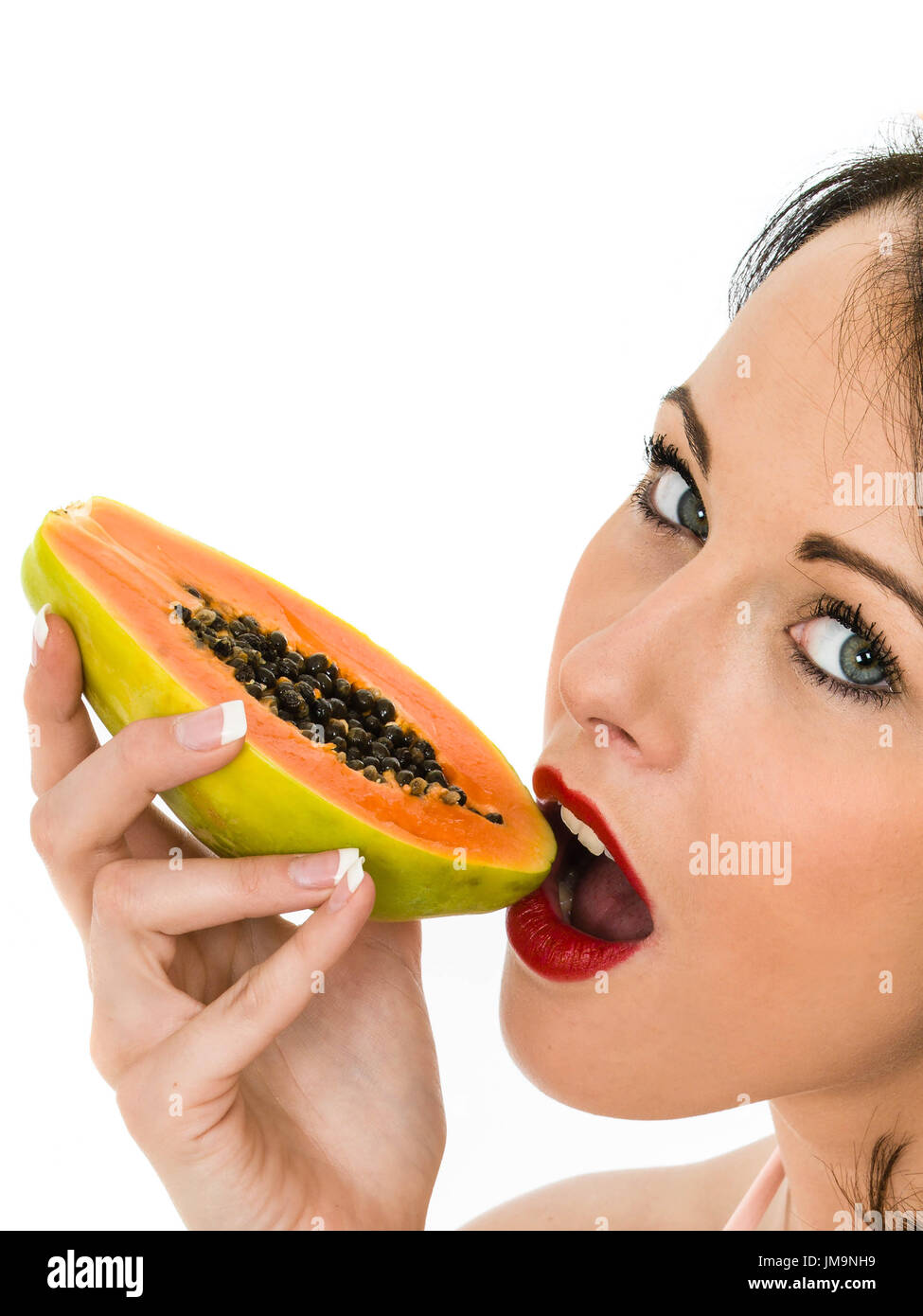 Healthy Young Woman Eating A Paw Paw Tropical Fruit Isolated Against A White Background Stock Photo Alamy
