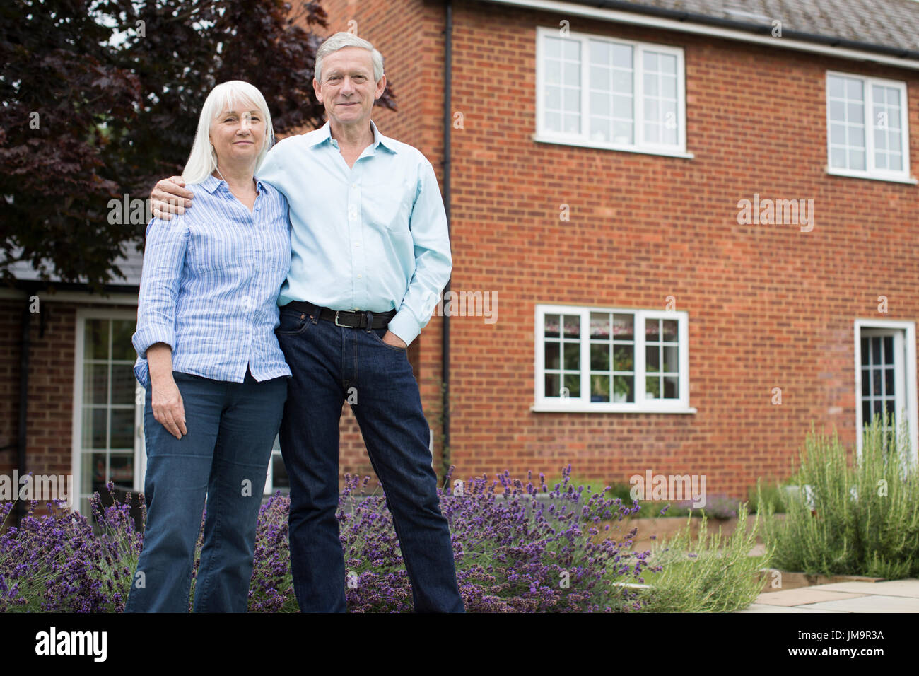 Portrait Of Retired Couple Standing Outside Home Stock Photo - Alamy