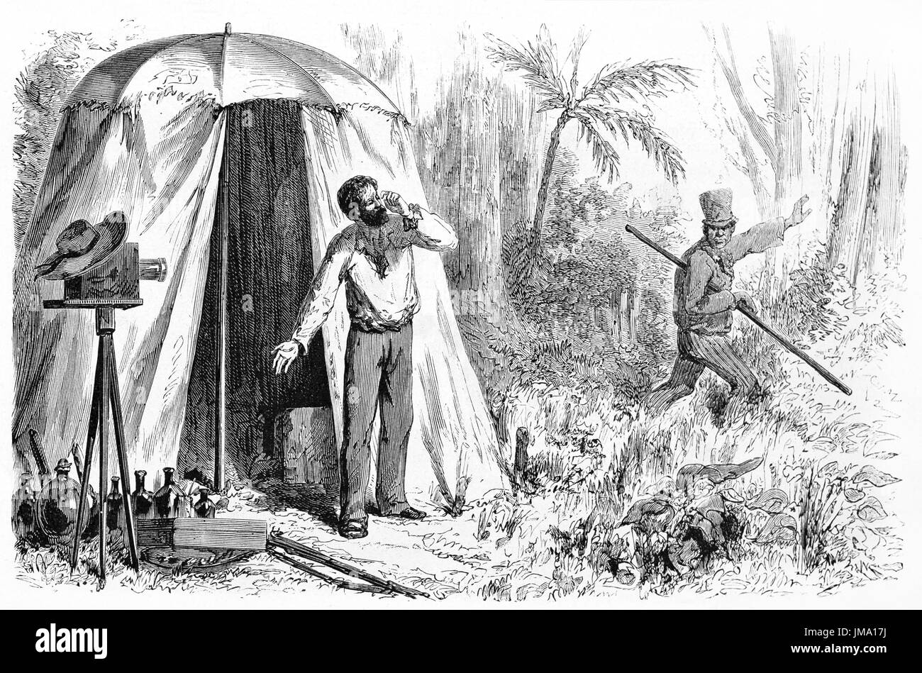 Old engraved illustration of a 19th century photographer in the Amazonian jungle with his equipment and his assistant. Created by Maurand, published o Stock Photo