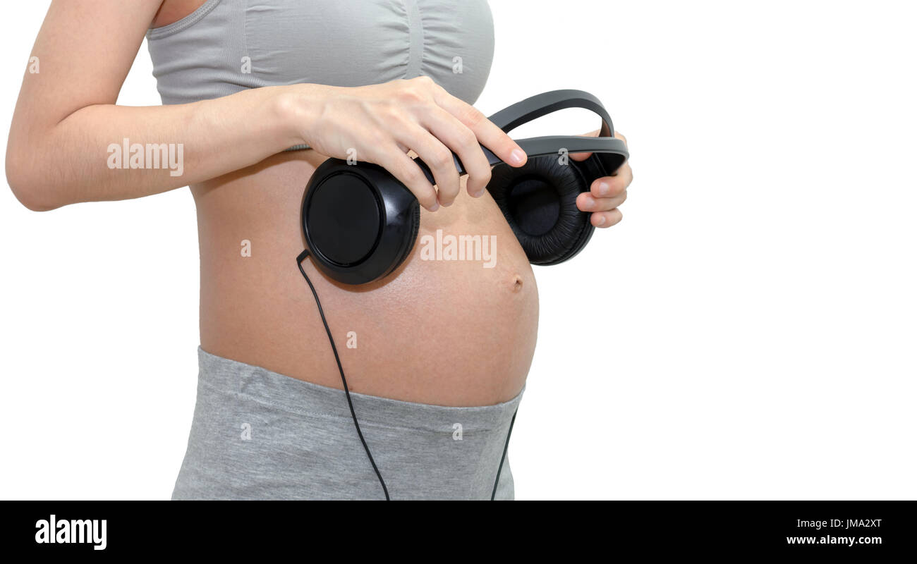 Woman With Headphones On Pregnant Belly Stock Photo - Download Image Now -  Abdomen, Adult, Anticipation - iStock