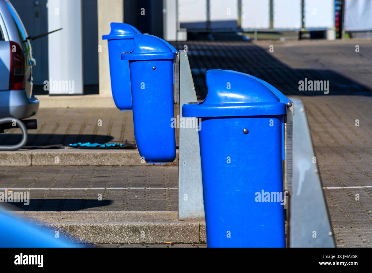 Trash can, waste container on a highway parking lot with resting place. Stock Photo
