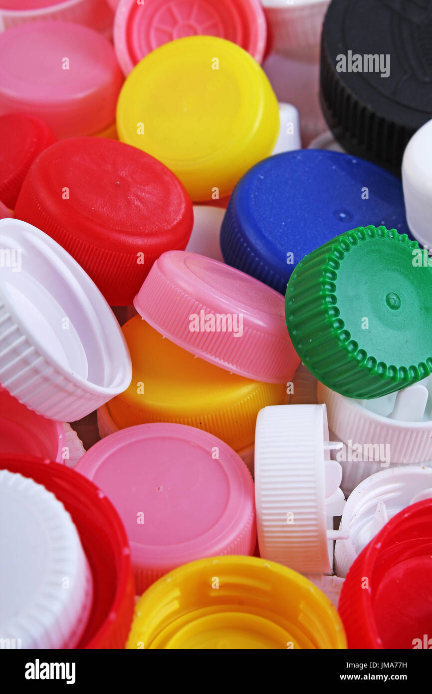 Collect plastic bottle caps. Closeup shot of stack of recyclable