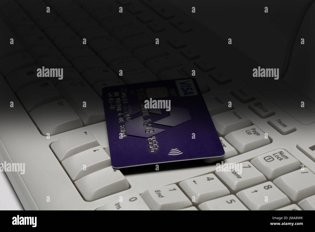 Debit card on keyboard. Stock Photo