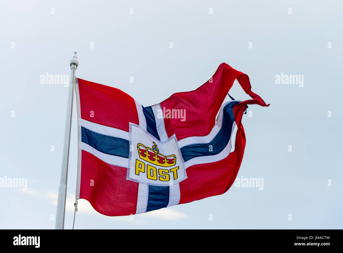 The Norwegian Post flag is displayed on all ships carrying post under contract from the Norwegian Postal Service. Stock Photo