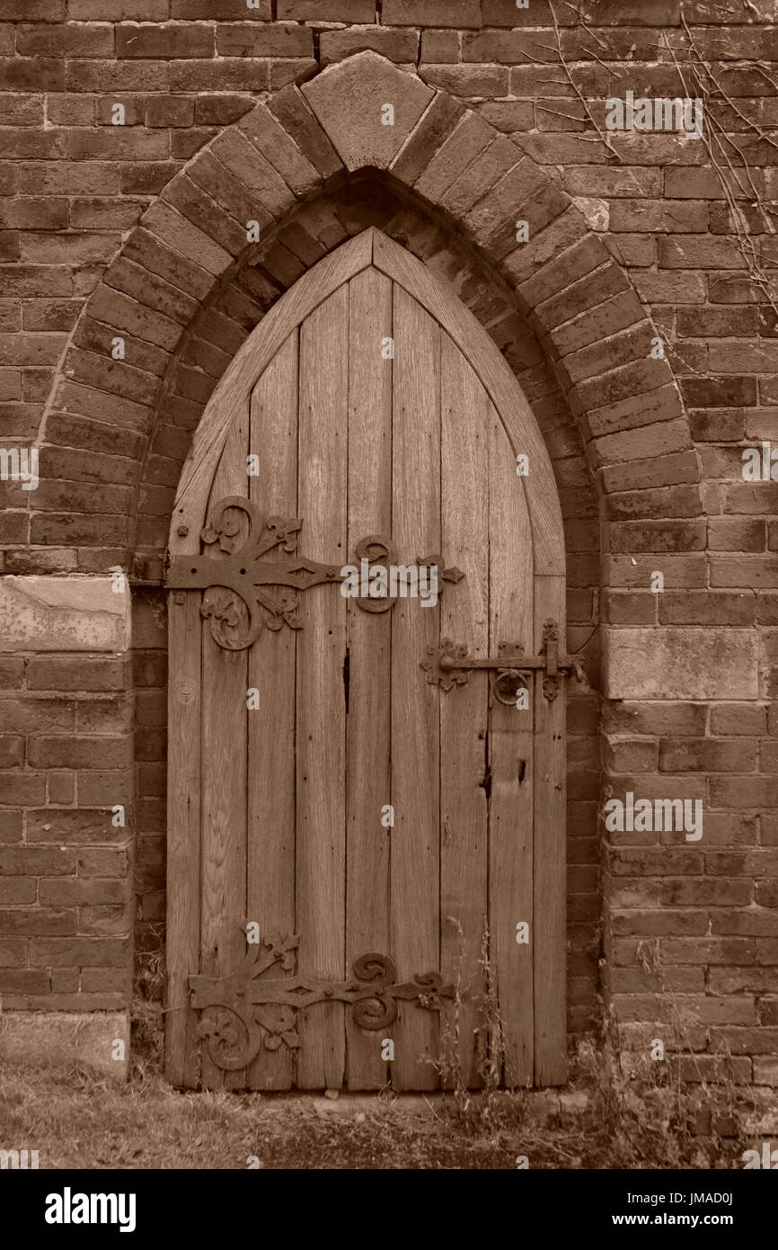 Weathered wooden door arched hi-res stock photography and images - Alamy