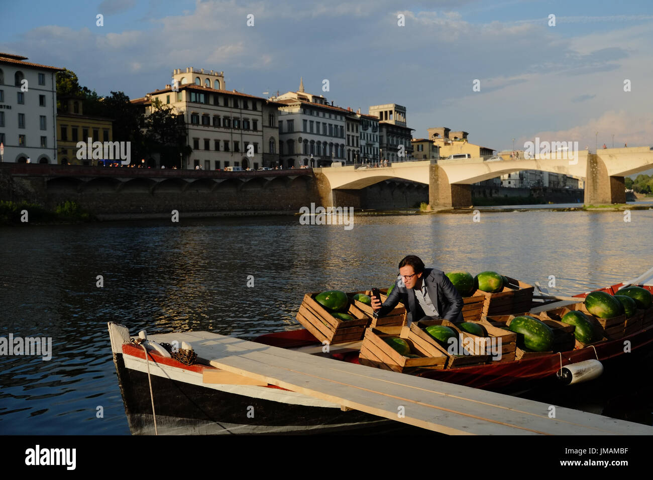 Florence, Italy. 26th July, 2017. Nardella doing selfies on the fruit boat. Mr Nardella, Florence mayor just opened up a new walking path on the left side of the Arno river which has been possible due to the low water level of the summer season. Florence,Italy. Credit: lorenzo codacci/Alamy Live News Stock Photo